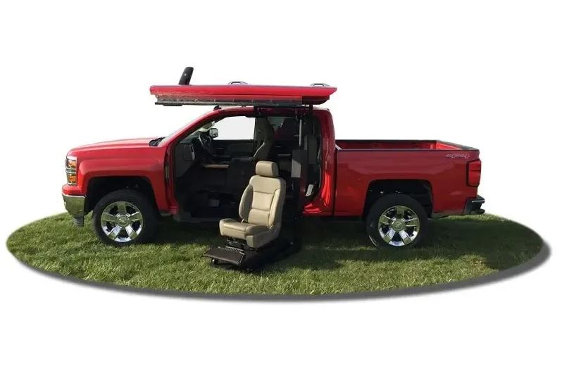 ATC Conversions Chevrolet Silverado 1500 Wheelchair Accessible truck with lift deployed from driver door.