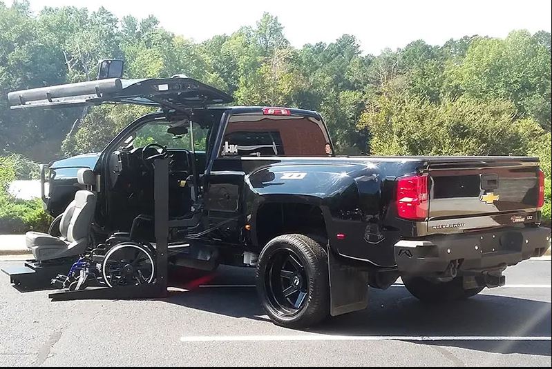 ATC Conversions Chevrolet Silverado 3500 Wheelchair Accessible truck with lift deployed from driver door