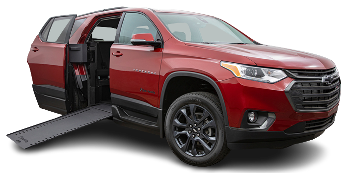 Red Chevrolet Traverse Wheelchair Accessible SUV with passenger side rear door open and ramp deployed.