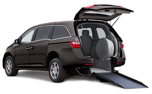 FMI Conversions Honda Odyssey with ramp deployed from rear hatch.