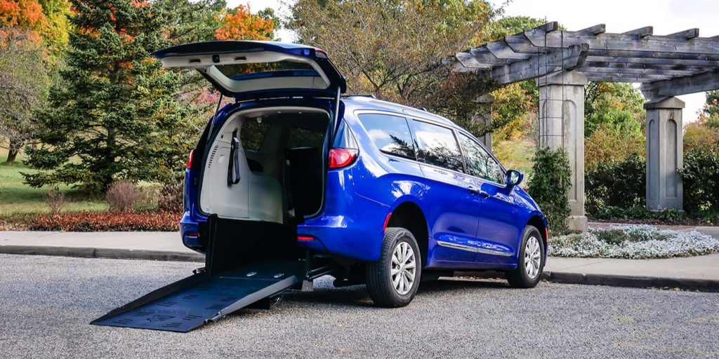FMI Conversions Chrysler Pacifica with rear entry conversion with ramp deployed from rear hatch.