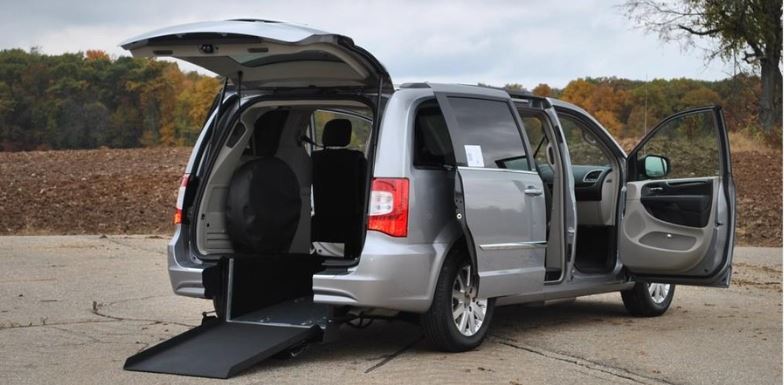 FMI Conversions Chrysler Town & Country with rear entry conversion with ramp deployed from rear hatch.