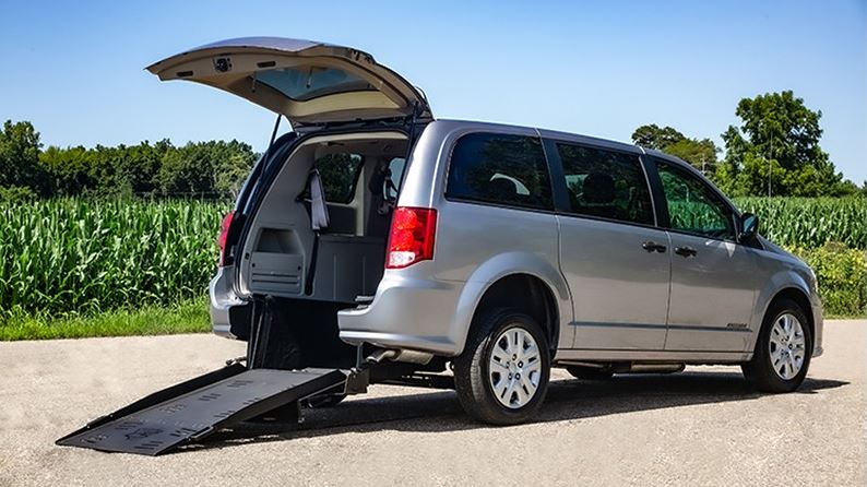 FMI Conversions Dodge Grand Caravan with ramp deployed from rear hatch.