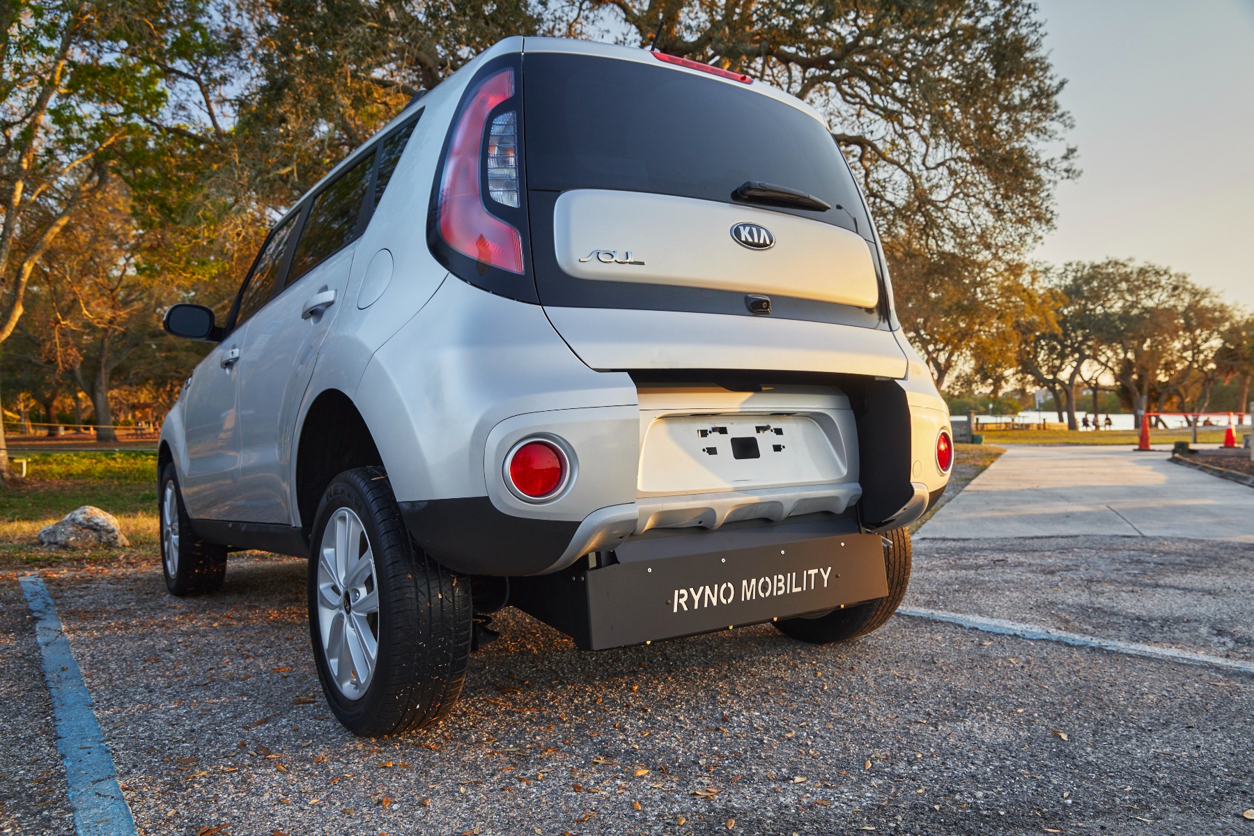 Rear end of Ryno Kia Soul wheelchair accessible SUV displaying the brand Ryno on wheelchair accessible ramp.