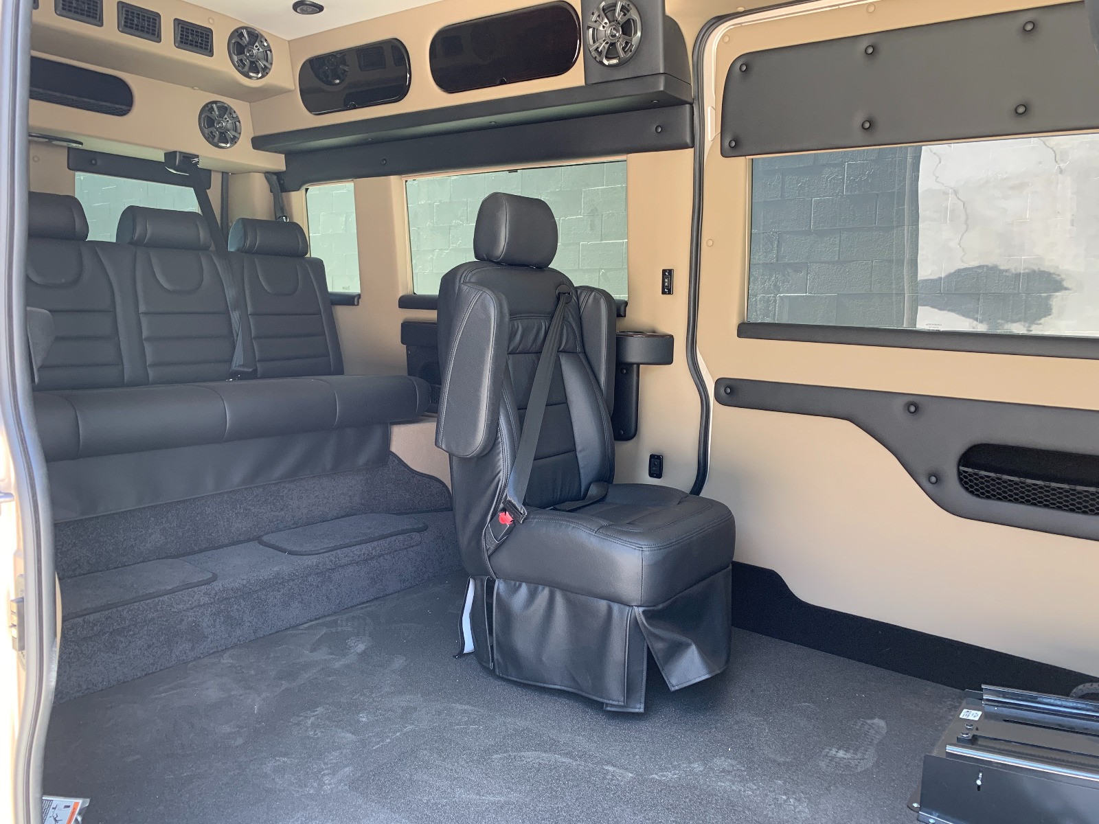Interior and rear bench seat of Ram ProMaster Full Size Wheelchair Van with Tempest XL-HT Conversion