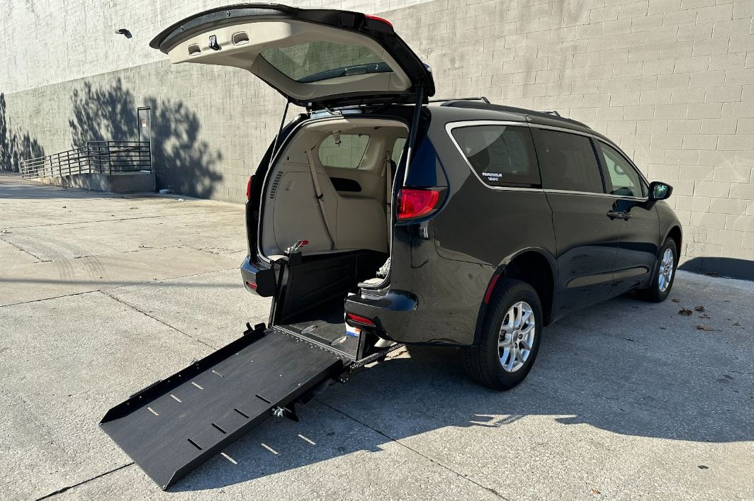 Chrysler Pacifica equipped with Ryno Mobility Rear Entry Conversion with ramp deployed from rear hatch.