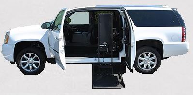 GMC Yukon equipped with Ryno SUV conversion with lift deployed from driver side doors.