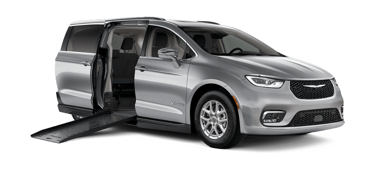 Silver Wheelchair Accessible Chrysler Pacifica with the passenger side sliding door open and a ramp deployed.