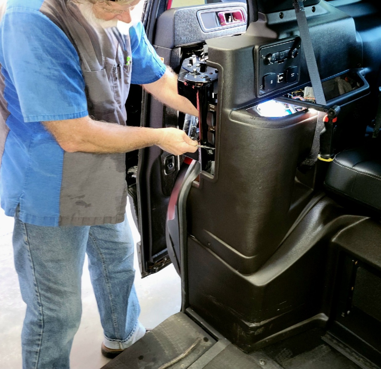 Mobility Express Wheelchair Van Service Technician Working On A Wheelchair Accessible Vehicle